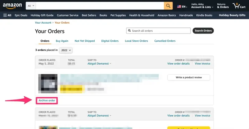 Amazon “Your Orders” page showing a past order with the Archive order button highlighted by a red arrow, indicating where users can archive an order in their Amazon account.